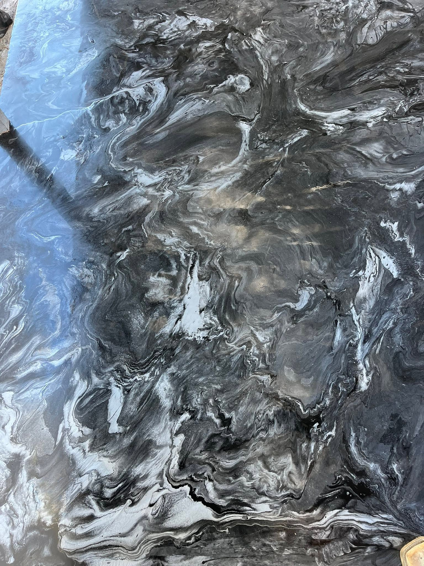 Close view of the flowing black and white epoxy finish