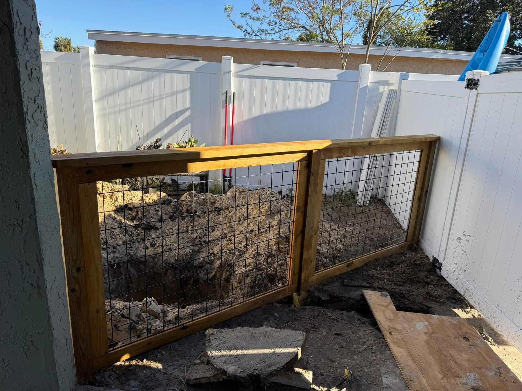 Custom double gate viewed from the right side of the patio