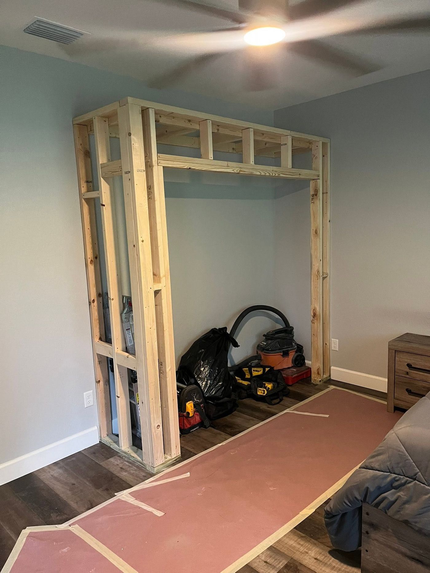 New wood framing for a custom built-in storage opening